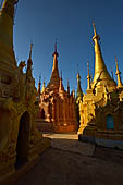 Inle Lake Myanmar. Indein, on the summit of a hill the  Shwe Inn Thein Paya a cluster of hundreds of ancient stupas. Many of them are ruined and overgrown with bushes. 